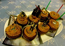 star wars cake and cupcake toppers with Yoda, Hans SOlo, Princess Leia, Luke Skywalker Darth Vader Bobba Fett and a few lightsaber party toppers