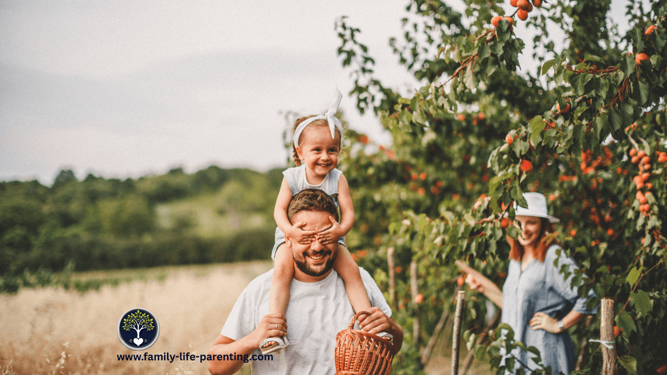 Happy family spending quality time outdoors, picking fruit together in nature and creating lasting memories that strengthen bonds