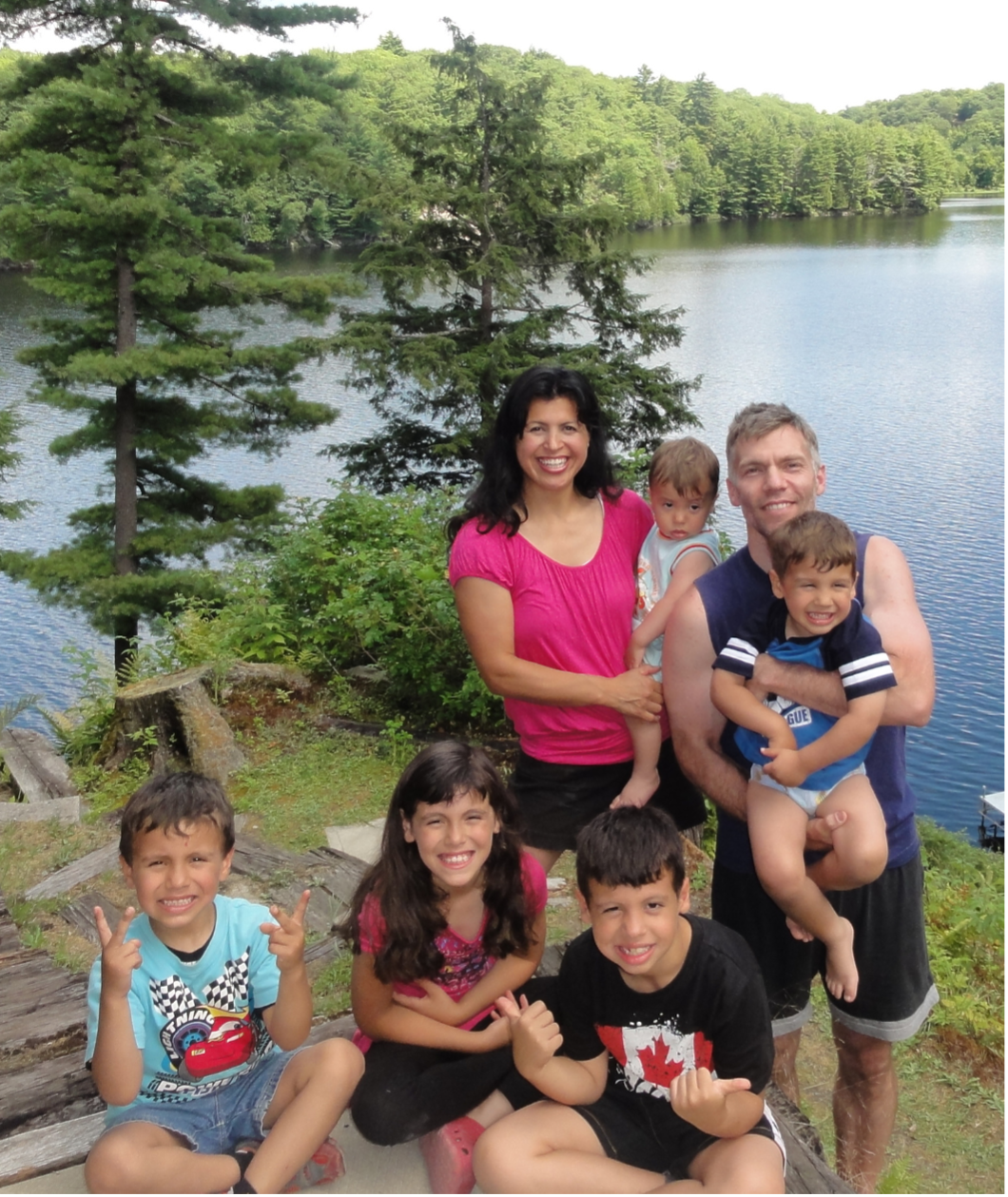 Christian Family in the beautiful outdoors in cottage county by a lake enjoying an amazing time together