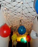 Holding cells hanging from the ceiling using supplies of Birthday balloons to hold Princess Leia and Queen Amidala and others of the resistance