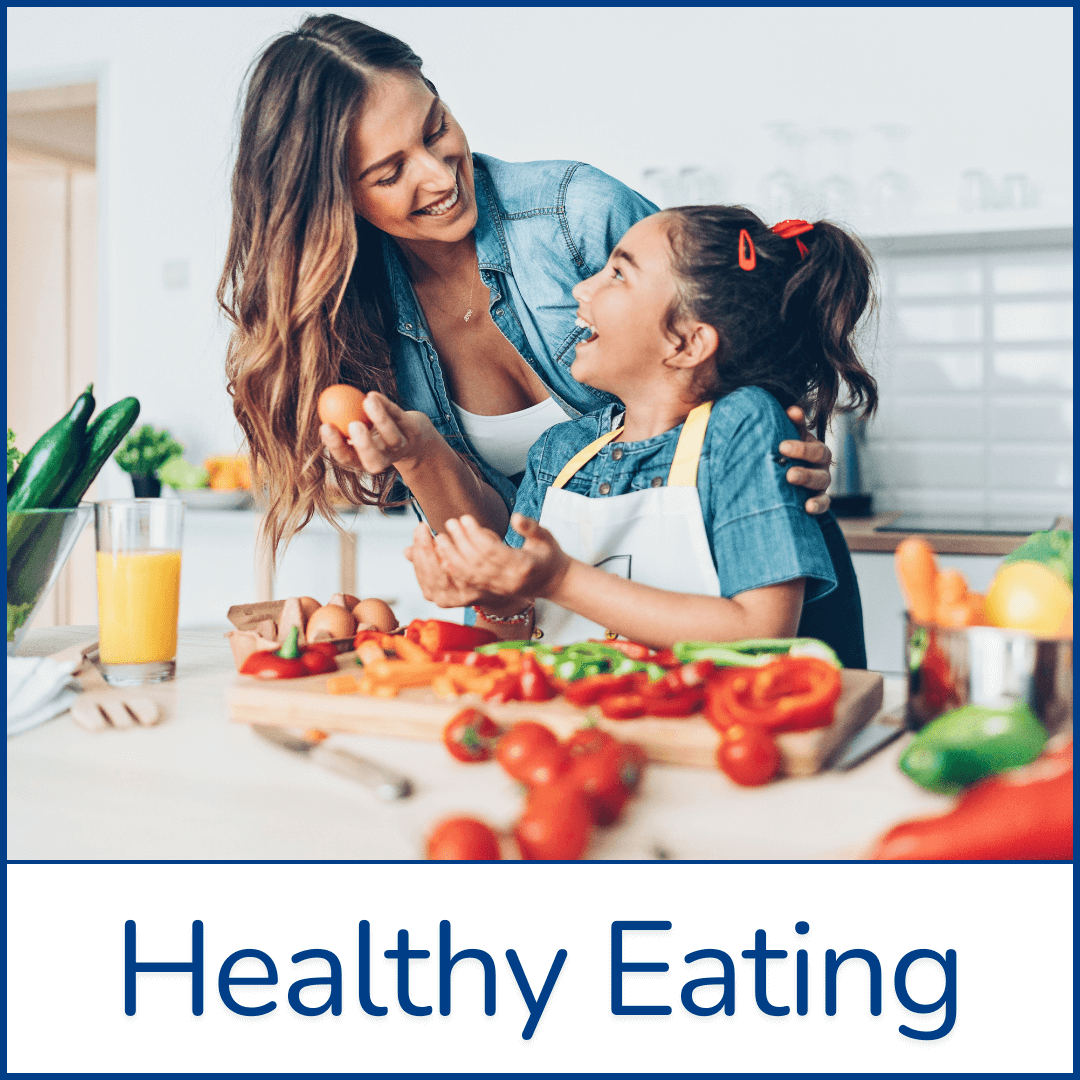 Mother + daughter smiling together preparing vegetables in the kitchen, showing family meal planning, healthy snacks for kids, nutritious recipes,  parenting support for lifelong healthy eating habits Mom and daughter cooking vegetables – family healthy eating and nutrition, meal planning, recipes